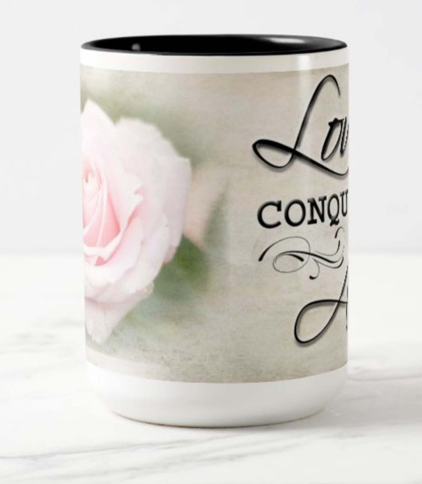 Lovely 15 oz. mug with the inspirational bible scripture "Love Conquers All' and flower photo.