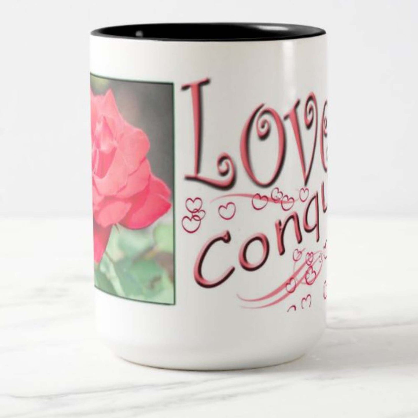 Mug with inspirational bible scripture "Love Conquers All' and flower image.