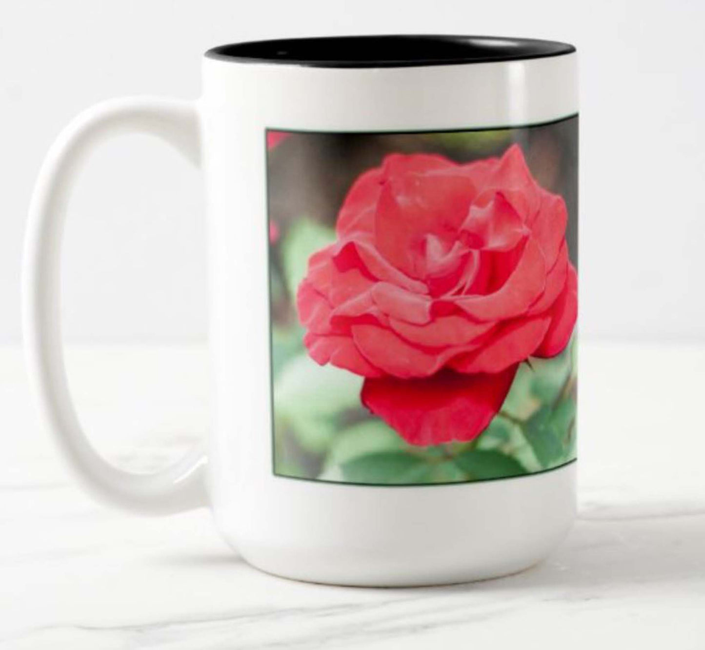 Mug with inspirational bible scripture "Love Conquers All' and flower image.