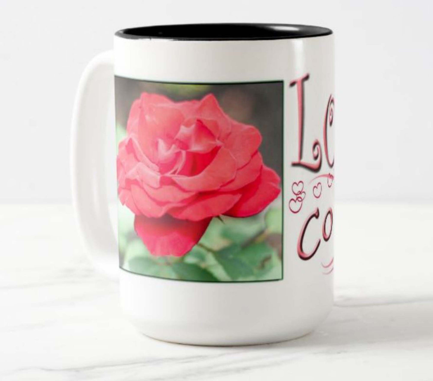 Mug with inspirational bible scripture "Love Conquers All' and flower image.