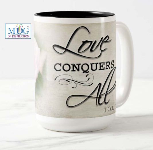 Lovely 15 oz. mug with the inspirational bible scripture "Love Conquers All' and flower photo.